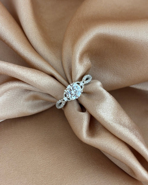 Brilliant Cut Solitaire Ring with Infinity Twist Band