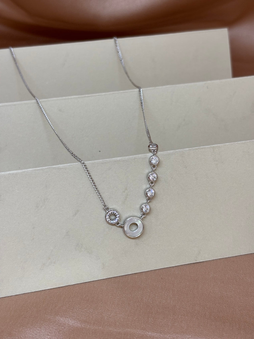 Asymmetric Orbital Crystal Necklace