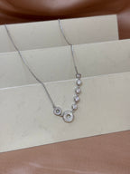 Asymmetric Orbital Crystal Necklace