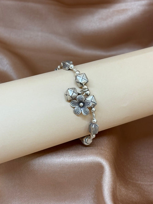 Beaded Silver Charm Bracelet with Geometric Accents