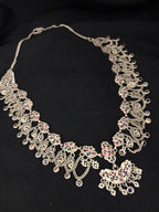 Intricate Silver Floral Necklace with Multicolored Accents