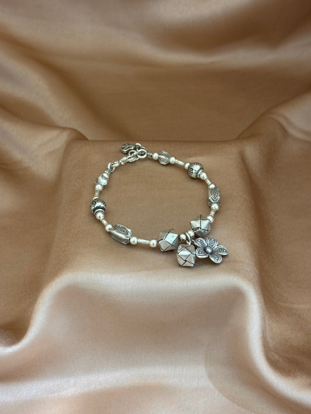 Beaded Silver Charm Bracelet with Geometric Accents