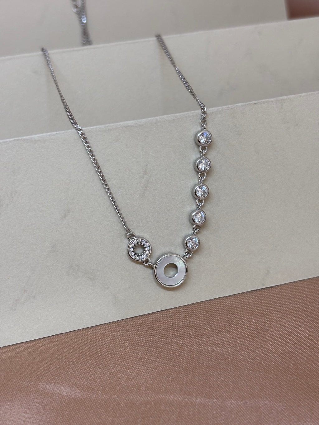 Asymmetric Orbital Crystal Necklace