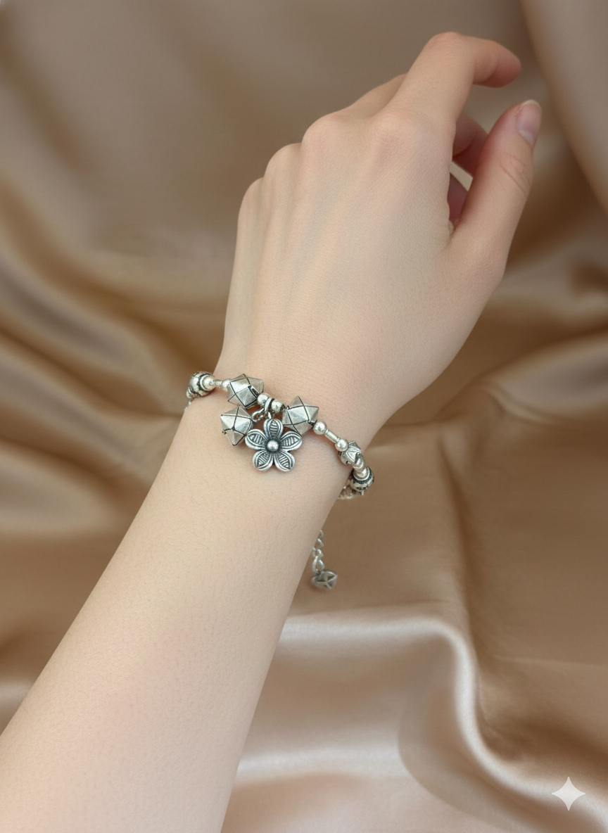 Beaded Silver Charm Bracelet with Geometric Accents